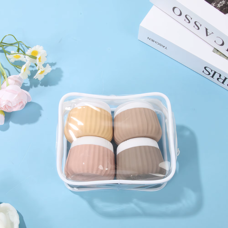 Flacon Vide Voyage pour Crème quatre flacons alignés - Beige - Rose - Vert - Bleu - Multicouleur